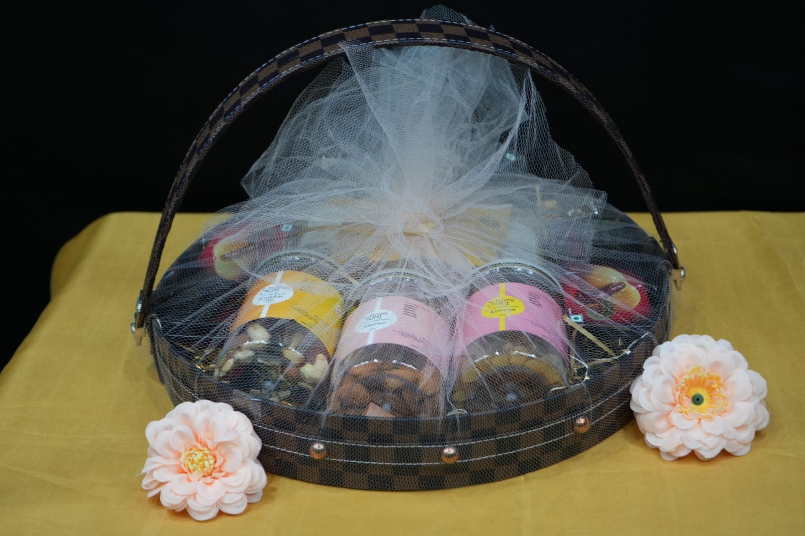A basket-style hamper with assorted packaged gifts